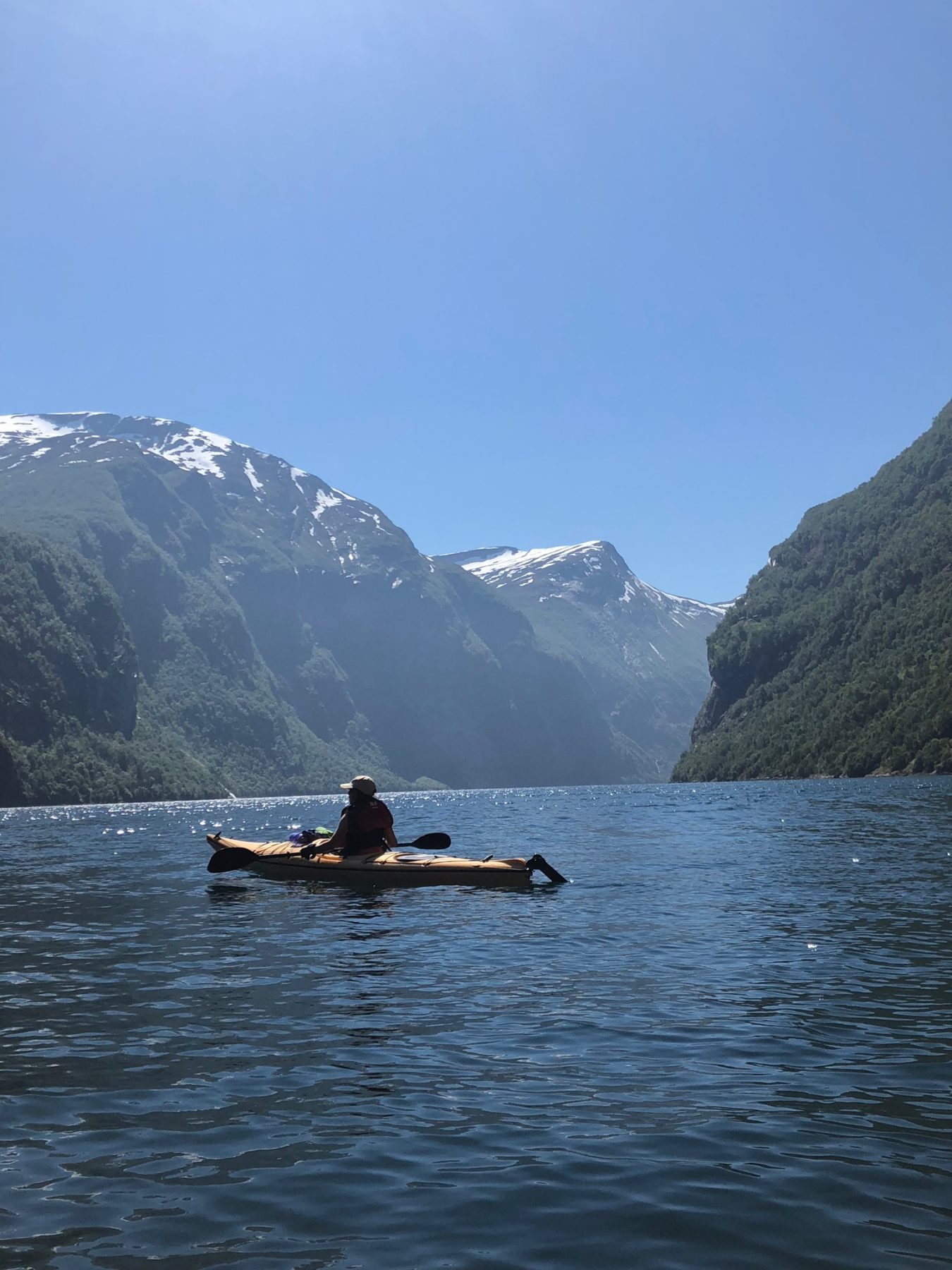 Norway - Jon was a kayaking guide before he was hired by Norway Adventures to guide us. In Geirangerfjord he was happily in his element. That, or he was relieved to muffle the voices of seven gregarious women for a short while. 🙂 Norway - Jon was a kayaking guide before he was hired by Norway Adventures to guide us. In Geirangerfjord he was happily in his element. That, or he was relieved to muffle the voices of seven gregarious women for a short while. 🙂