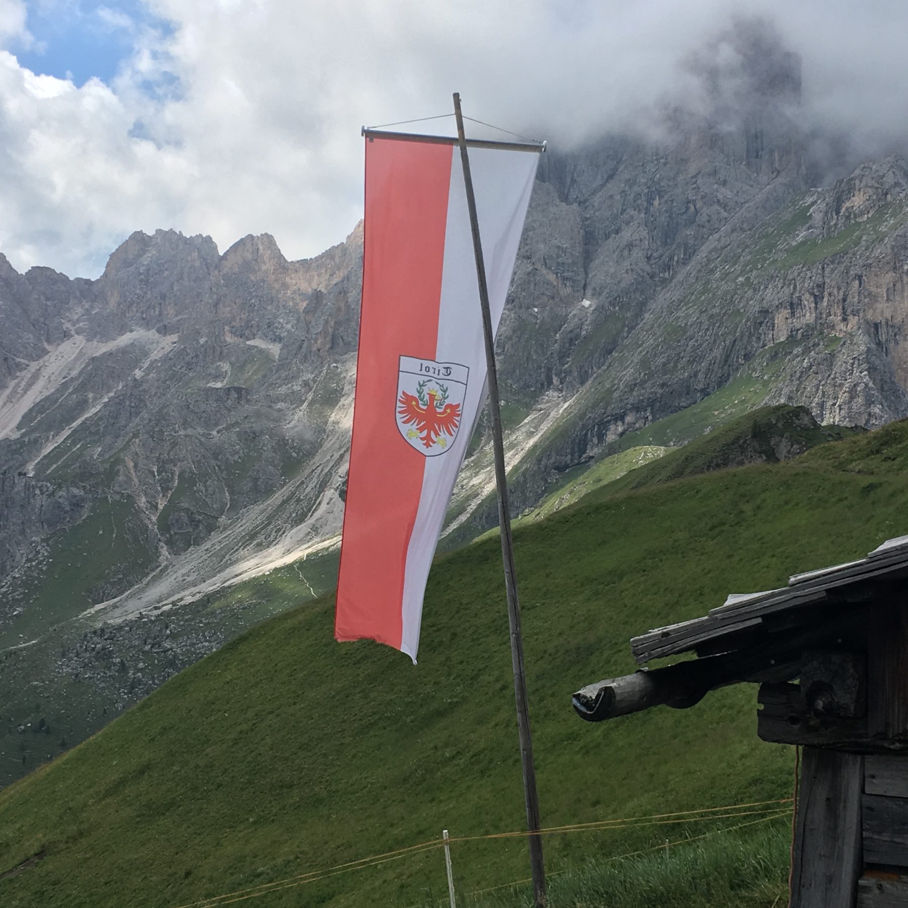 Dolomites, Italy - The South Tyrolian flag. And our lunch break, with hot, freshly prepared food. Dolomites, Italy - The South Tyrolian flag. And our lunch break, with hot, freshly prepared food.