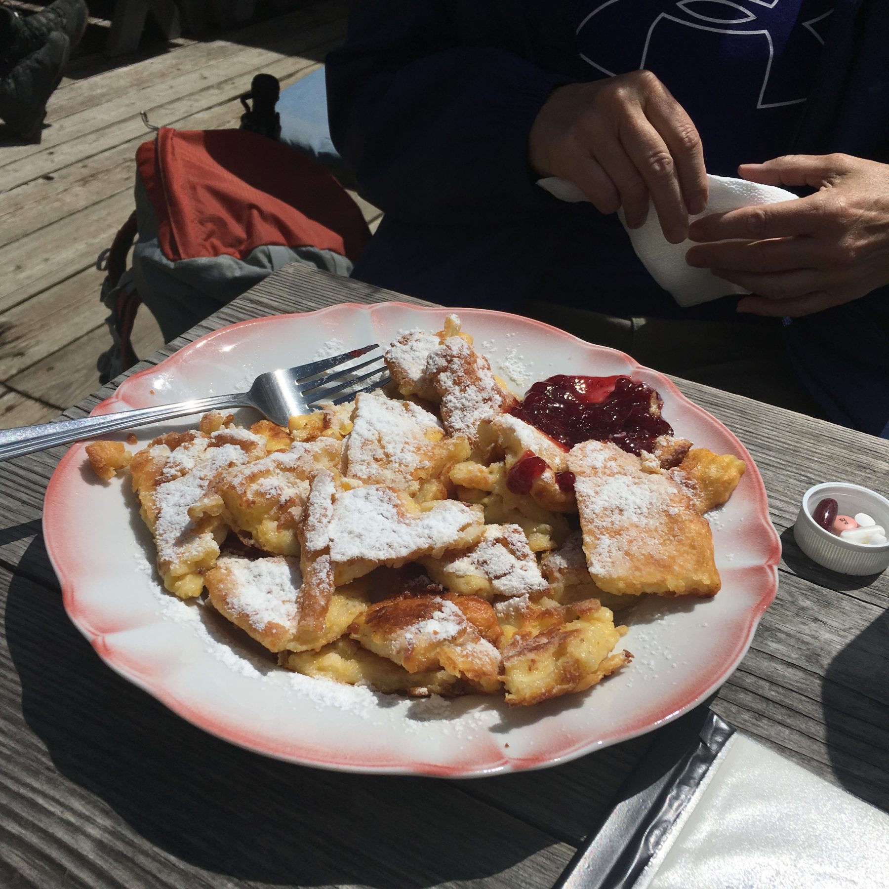 Dolomites, Italy - The Tyrolian Kiachl, a sweet dough pastry dusted with powdered sugar and served with cranberry jam. A perfect pick-me-up during a hike. Dolomites, Italy - The Tyrolian Kiachl, a sweet dough pastry dusted with powdered sugar and served with cranberry jam. A perfect pick-me-up during a hike.