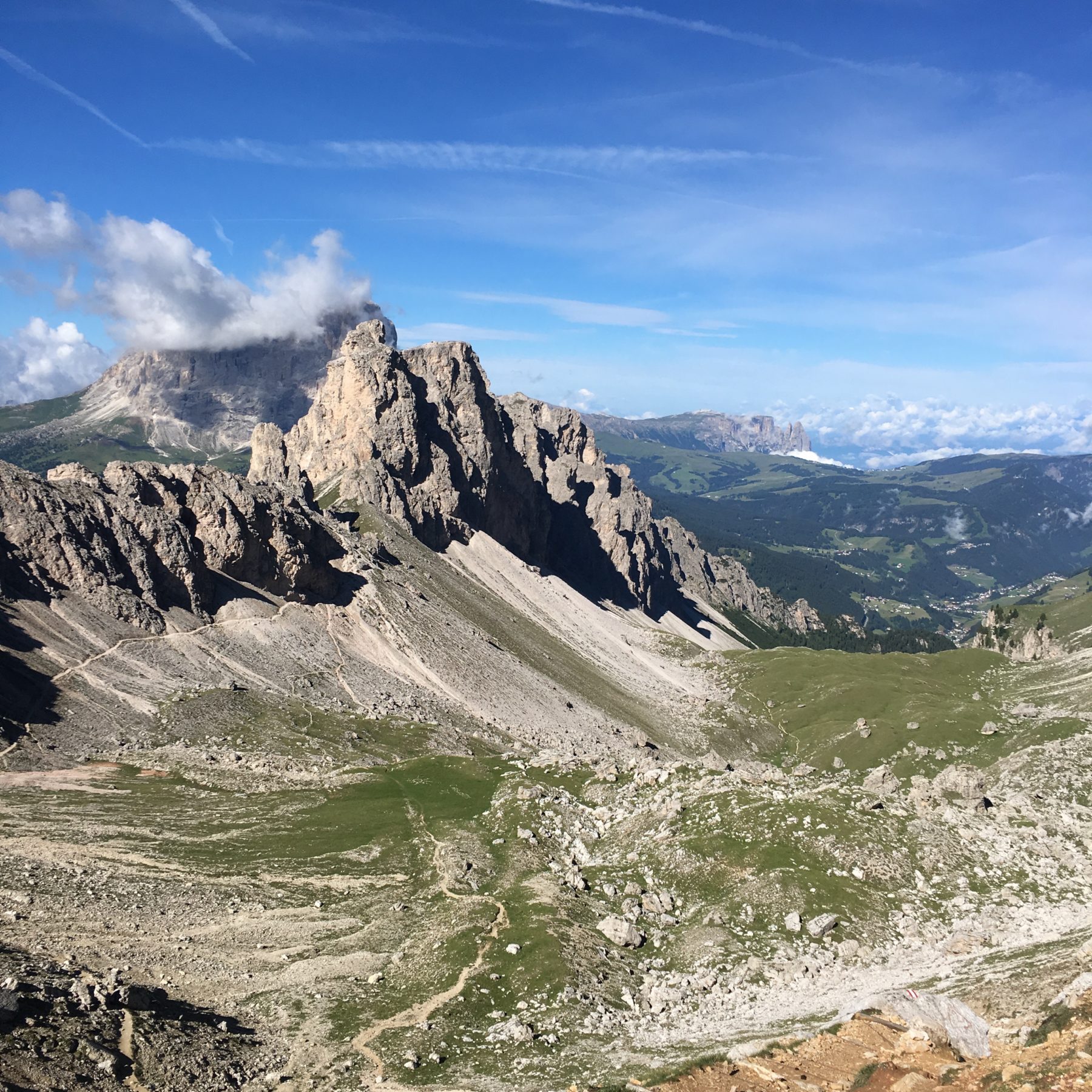 Dolomites, Italy - Thankfully, the weather had cleared overnight and we were on the trail by 7:30 am. Our path hugged the mountains to the left and then turned left between them, to Corvara in Badia. Dolomites, Italy - Thankfully, the weather had cleared overnight and we were on the trail by 7:30 am. Our path hugged the mountains to the left and then turned left between them, to Corvara in Badia.