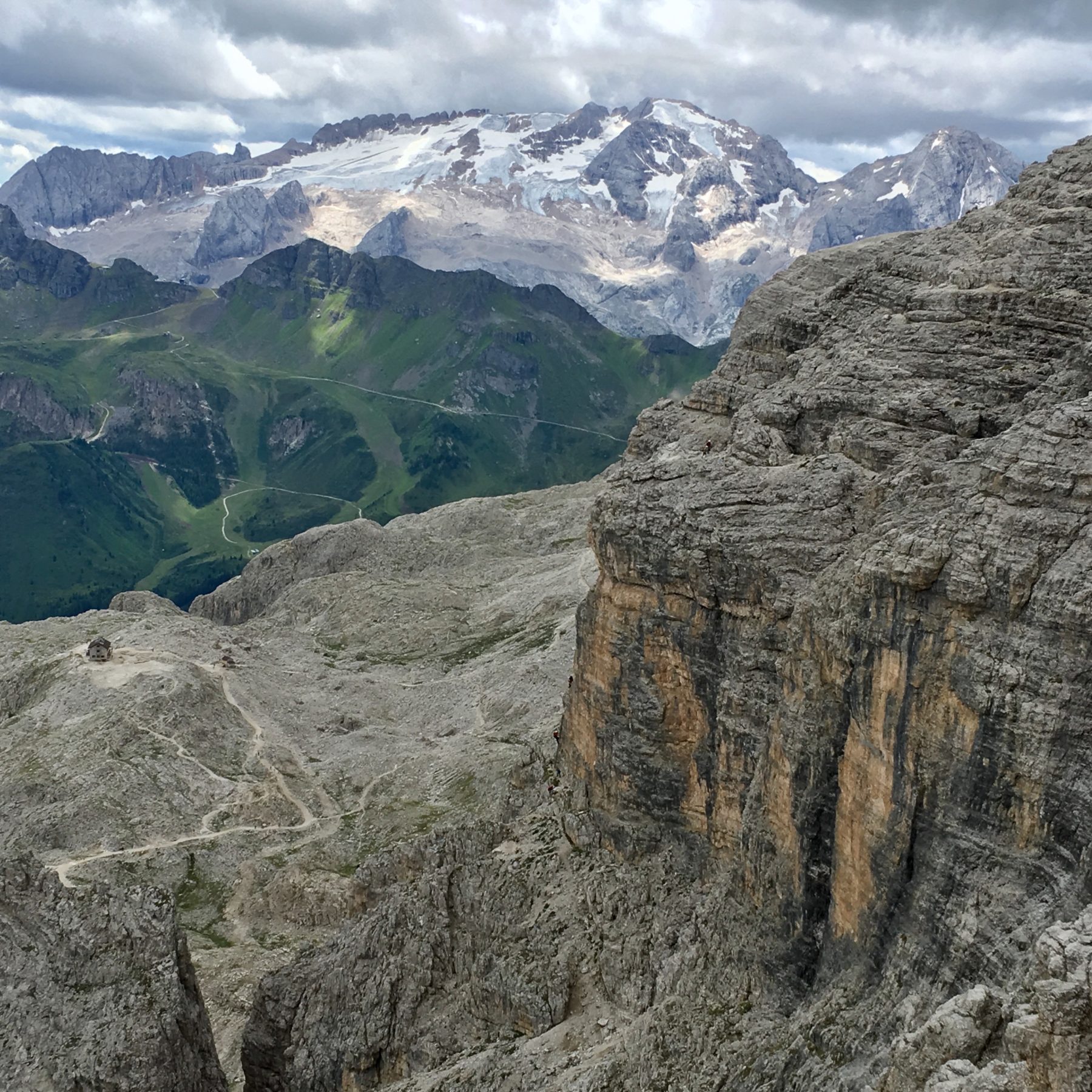 Dolomites, Italy - A view of the Marmolada in the distance and of the Rifugio Franz Kostner below. The trail we took to the ferrata and the rock face we climbed…from the top of the Ferrata Piz da Lech. Dolomites, Italy - A view of the Marmolada in the distance and of the Rifugio Franz Kostner below. The trail we took to the ferrata and the rock face we climbed…from the top of the Ferrata Piz da Lech.