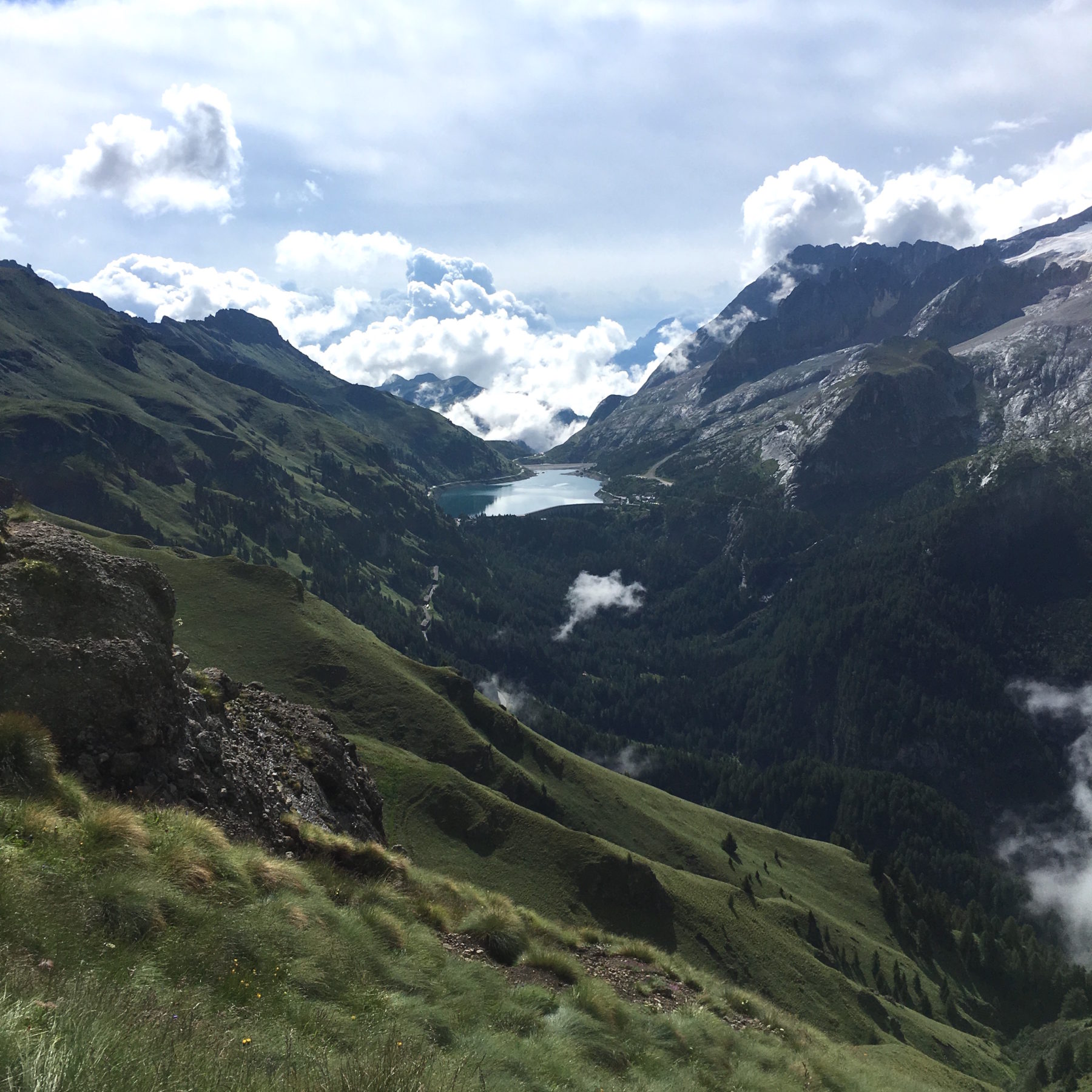 Dolomites, Italy - Our lunch destination: Col de Cuk at the edge of the reservoir ahead in Canazei. They’re known for their amazing pizza! Dolomites, Italy - Our lunch destination: Col de Cuk at the edge of the reservoir ahead in Canazei. They’re known for their amazing pizza!