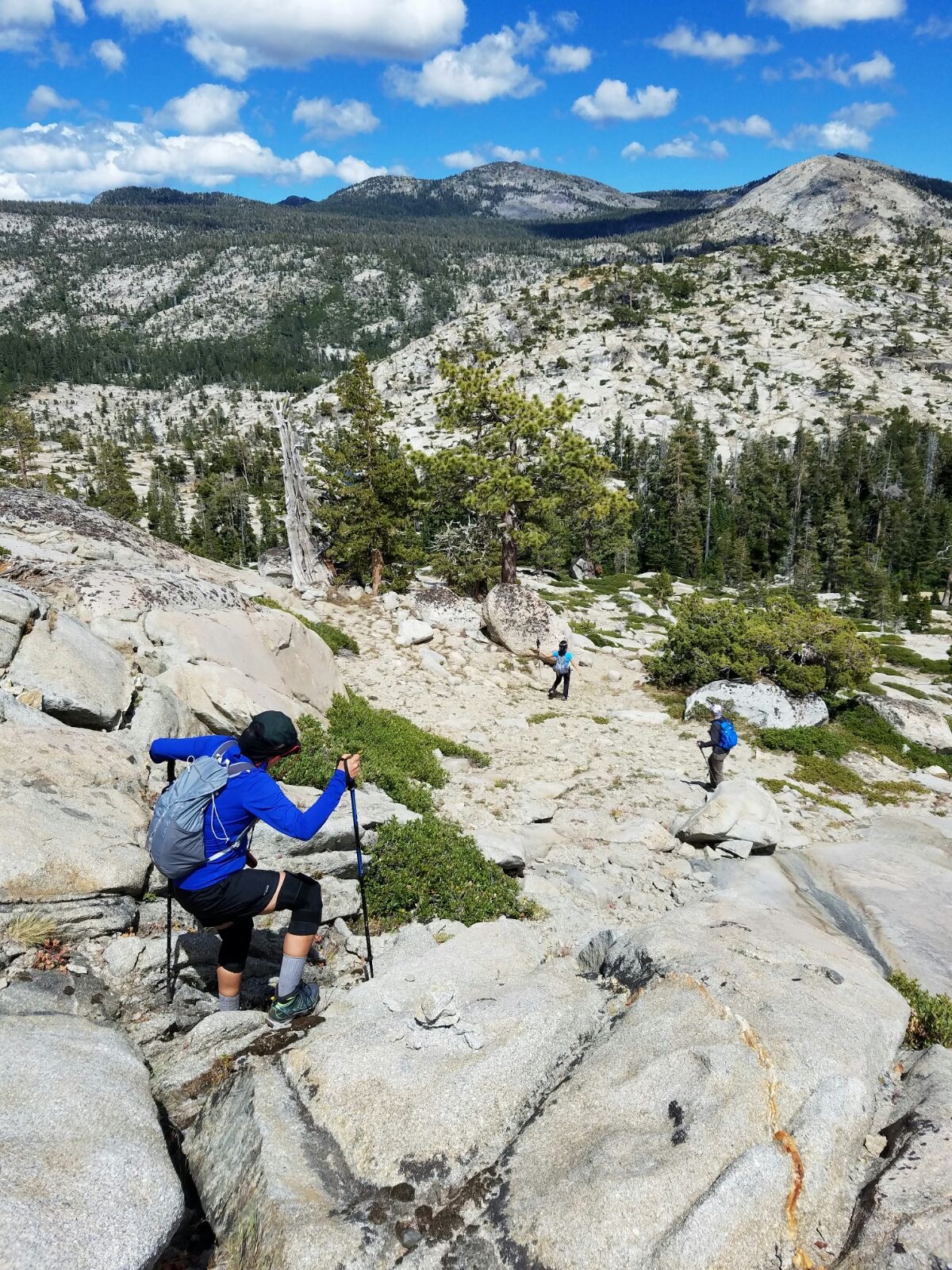 Desolation Wilderness California - Rock scrambling on steep granite slopes to stay on course. We feel like trailblazers in this landscape with no discernible trail. Desolation Wilderness California - Rock scrambling on steep granite slopes to stay on course. We feel like trailblazers in this landscape with no discernible trail.