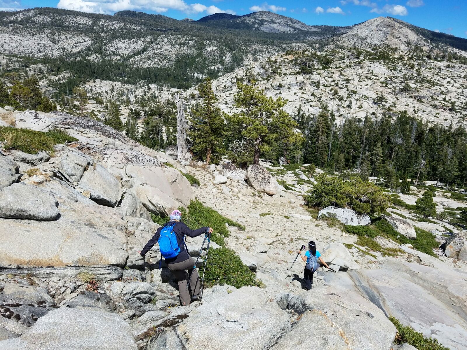 Desolation Wilderness California - We had read it was difficult to follow the trail here across granite slopes, crossing streams and spending lots of time focused on navigation, and it was. It’s difficult to tell if small piles of rocks here and there are “ducks” marking the trail, or a divergent path. We followed a fair amount of false leads but it’s worth it when you see grand vistas like this. Desolation Wilderness California - We had read it was difficult to follow the trail here across granite slopes, crossing streams and spending lots of time focused on navigation, and it was. It’s difficult to tell if small piles of rocks here and there are “ducks” marking the trail, or a divergent path. We followed a fair amount of false leads but it’s worth it when you see grand vistas like this.
