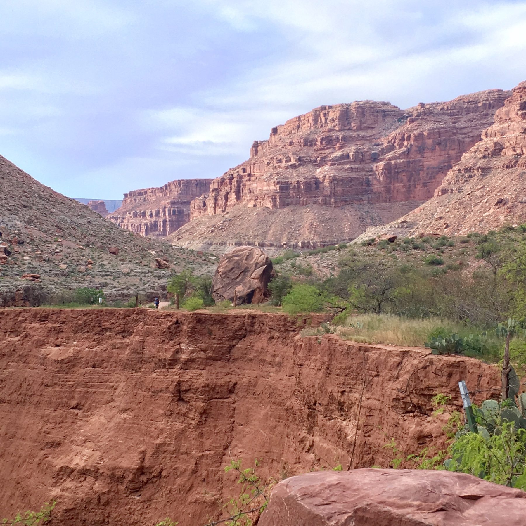 Havasupai - Everywhere we look, we are surrounded by high cliffs of Supai sandstone, a deep red rock found throughout the Grand Canyon and named after this location. Havasupai - Everywhere we look, we are surrounded by high cliffs of Supai sandstone, a deep red rock found throughout the Grand Canyon and named after this location.