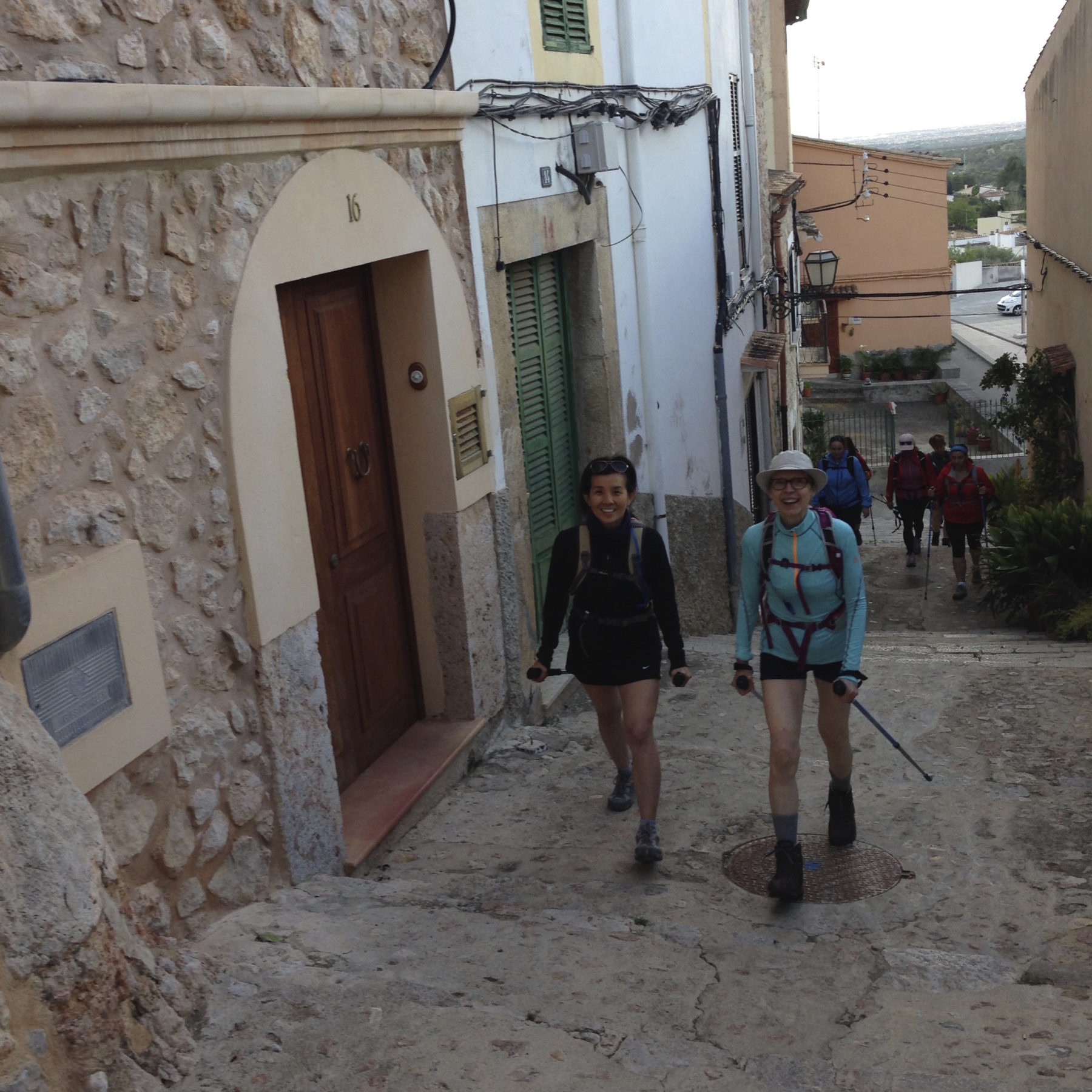 Mallorca, Spain - It’s still early in the morning and Jenny and Maarit respectfully stay quiet as we hike through the village of Bunyola to the nearby trailhead. Mallorca, Spain - It’s still early in the morning and Jenny and Maarit respectfully stay quiet as we hike through the village of Bunyola to the nearby trailhead.