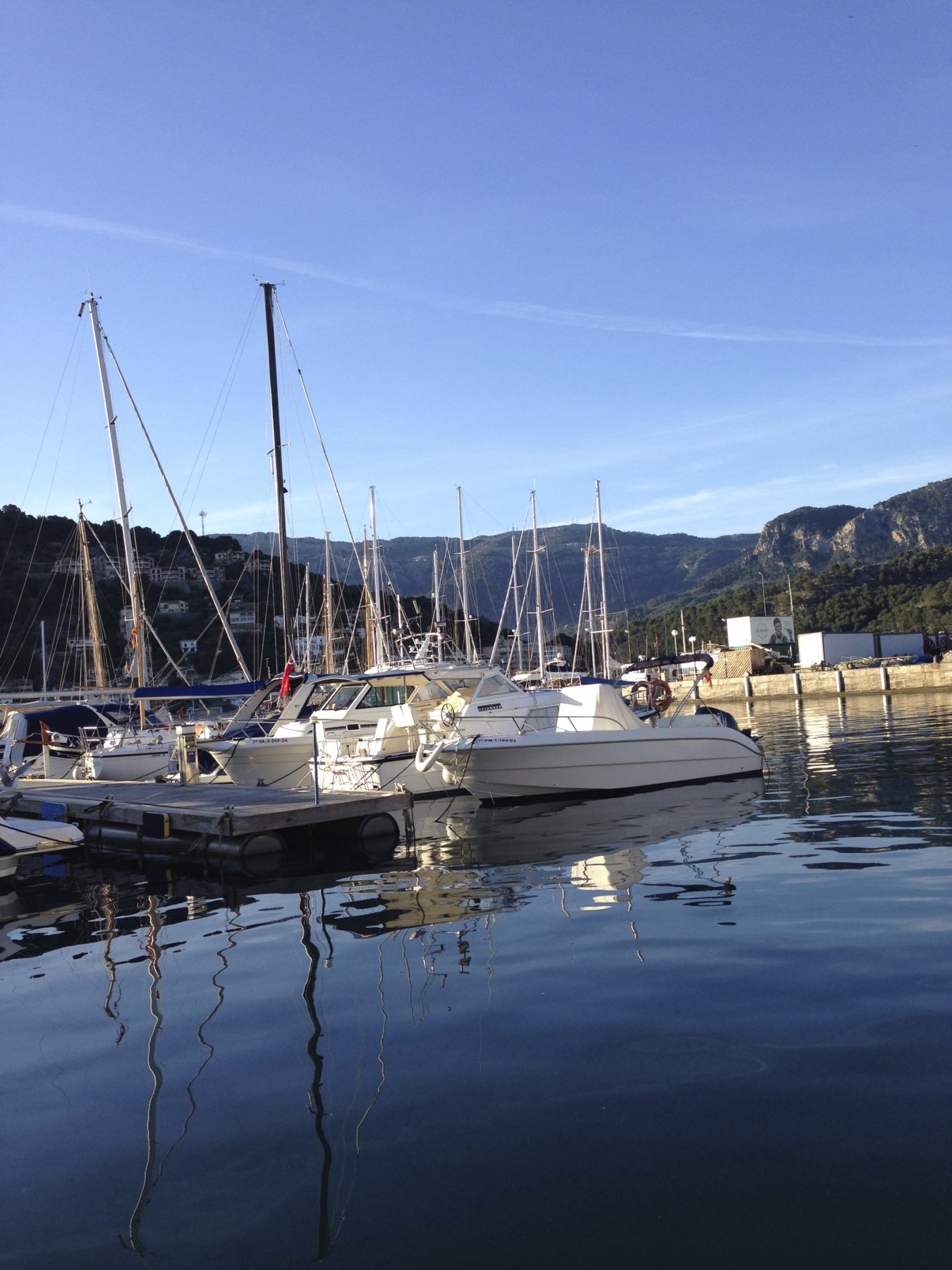 Mallorca, Spain - A beautiful sunny morning in the Port de Sóller! A perfect day for a hike. Mallorca, Spain - A beautiful sunny morning in the Port de Sóller! A perfect day for a hike.