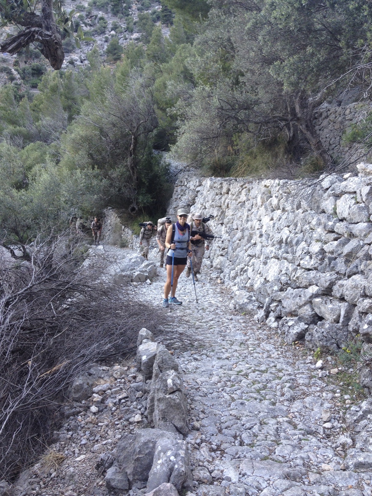 Mallorca, Spain - Ceding the right-of-way to the Mallorcan Army on a training run. They’re carrying their training weapons and a heavy backpack of kit. Mallorca, Spain - Ceding the right-of-way to the Mallorcan Army on a training run. They’re carrying their training weapons and a heavy backpack of kit.